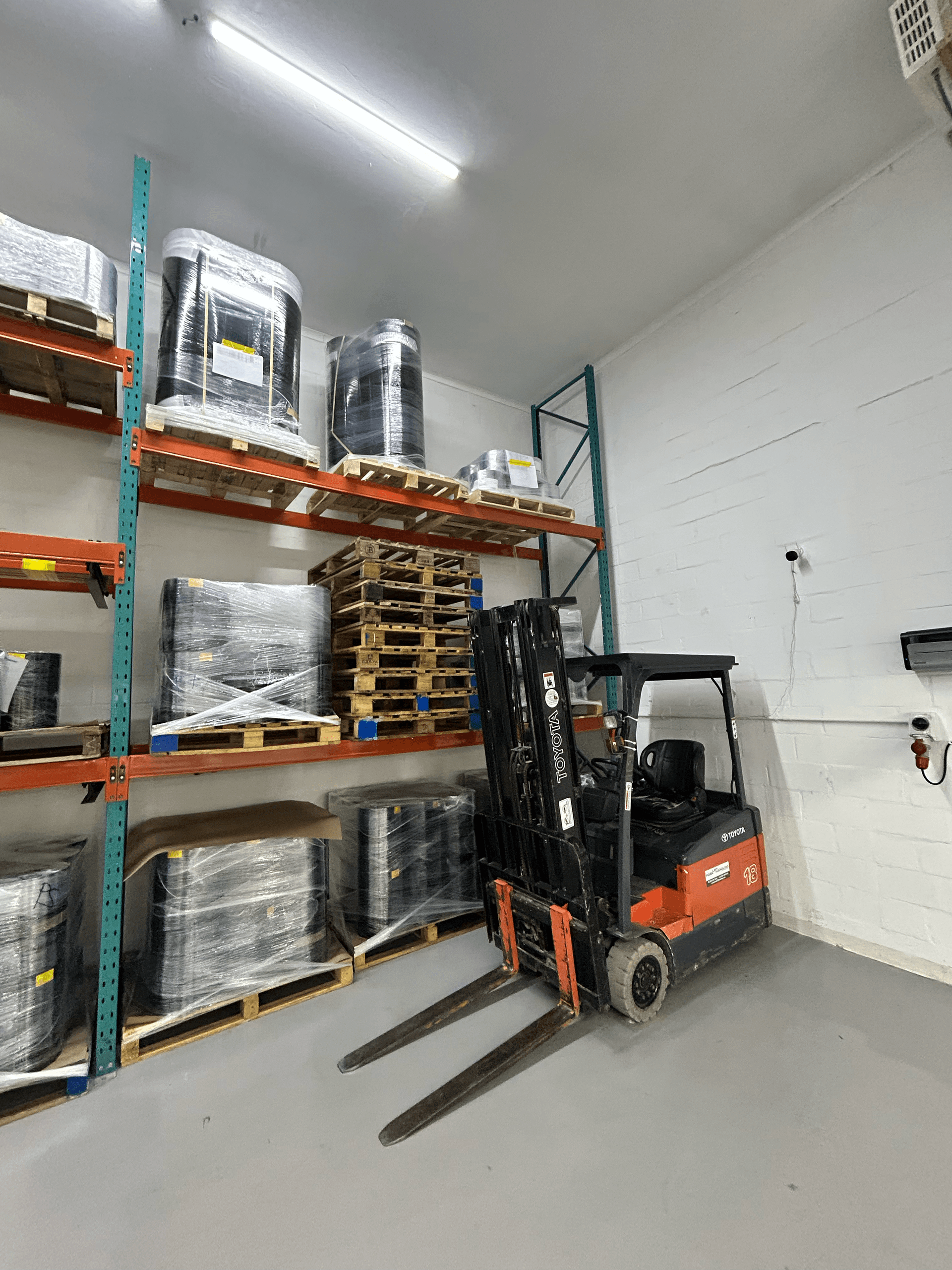 Warehouse storage with racked master rolls